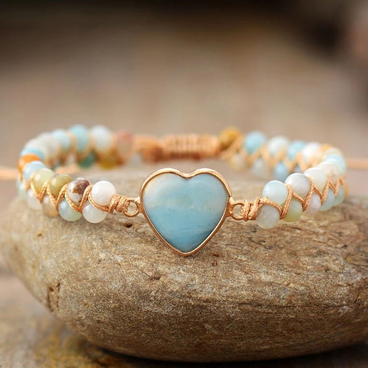 Blue stone woven bracelet with heart-shaped peach stone