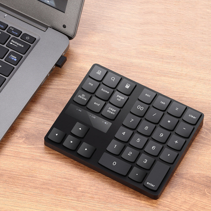 Multifunctional wireless 35-key numeric keypad with charging function