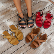 Neue Schnalle Römersandalen Sommermode Einzeilige Cross-Strap-Design Strandschuhe für Frauen Flache Slides Hausschuhe mit niedrigem Absatz